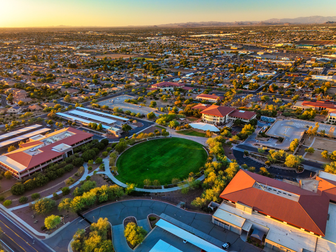 Aerial view of suburban neighborhood at sunset